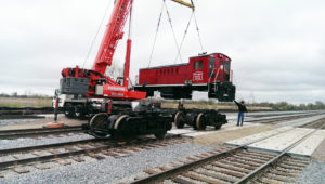 Crane lifting locomotive